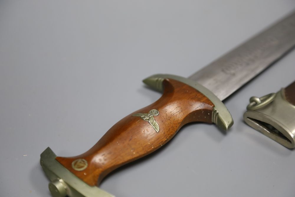 A German WW2 Third Reich SA dagger, by C. G. Haenel, Suhl, the 22cm blade, inscribed Alles Fur Deutschland with brown nickel mounted